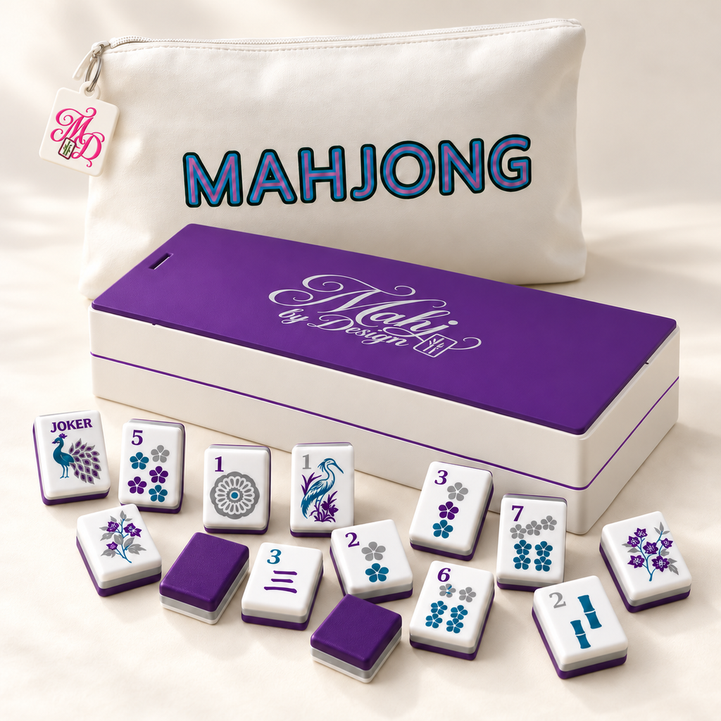 Purple Signature mahjong tiles with coordinating storage box and tagged white bag. Digital product rendering.